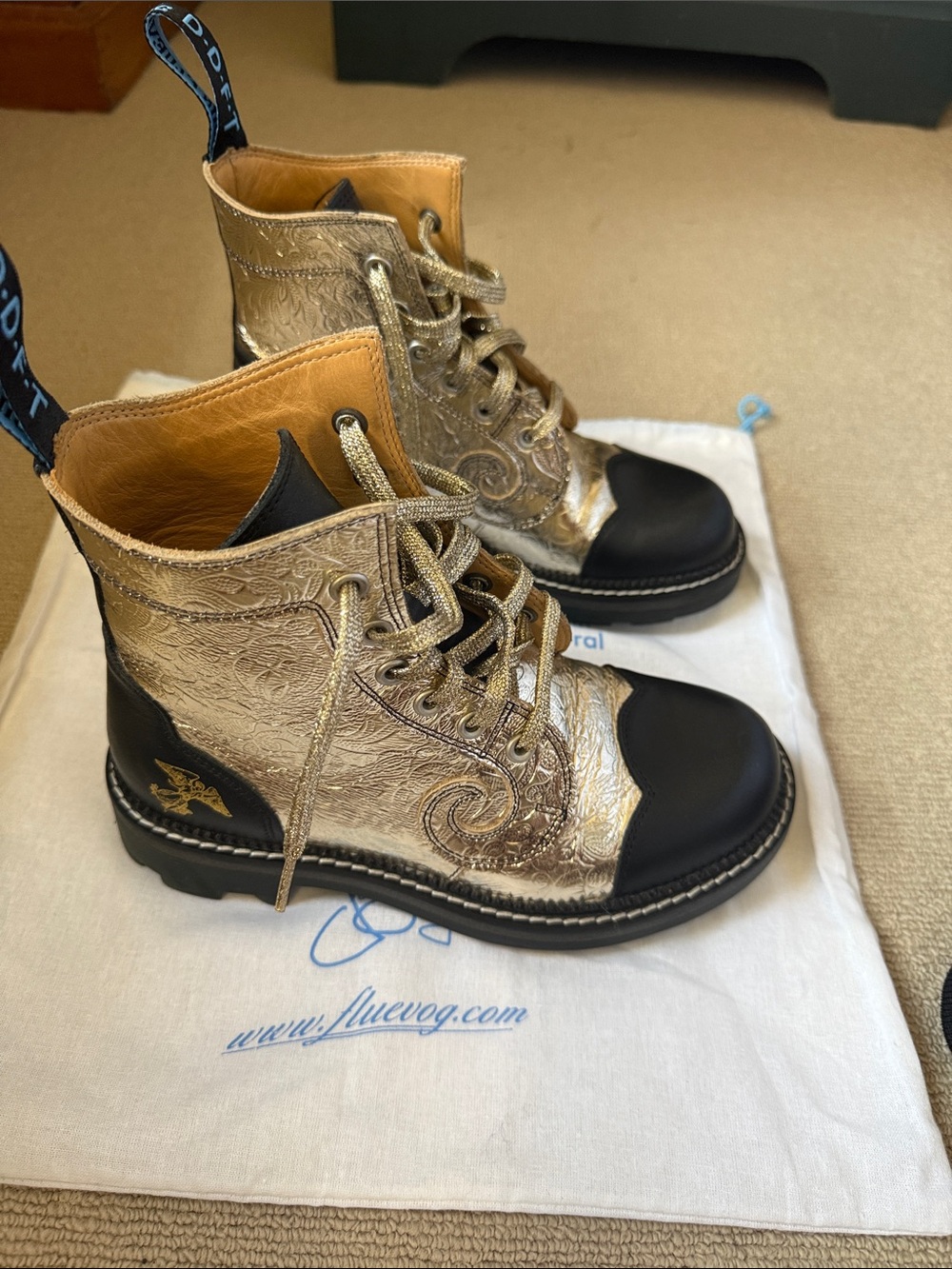John Fluevog Gold and Black Embossed Lace-Up Combat Boots (Derby Swirl)